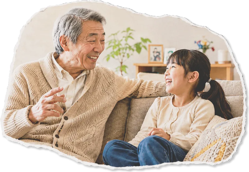 ソファで会話する祖父と孫娘